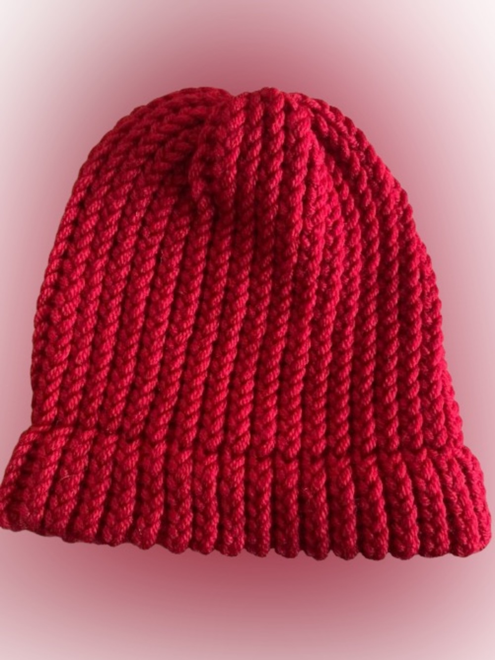 Handmade cozy red knit beanie hat for adults.